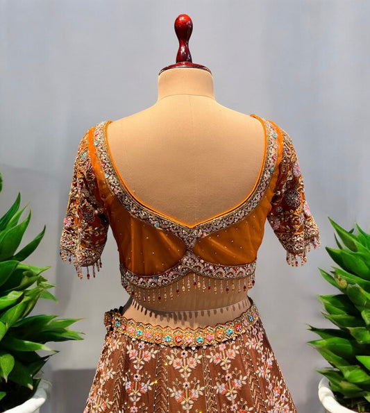 COPPER COLOUR CHINON LEHENGA WITH READYMADE BLOUSE & NET DUPATTA EMBELLISHED WITH CUTDANA, RESHAM & ZARI WORK