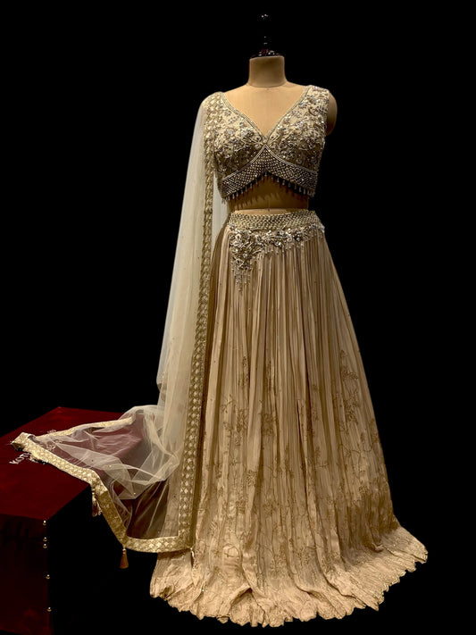 IVORY COLOUR GEORGETTE SKIRT WITH READYMADE CROP-TOP & NET DUPATTA EMBELLISHED WITH KARDHANA BEADS & SEQUINS WORK