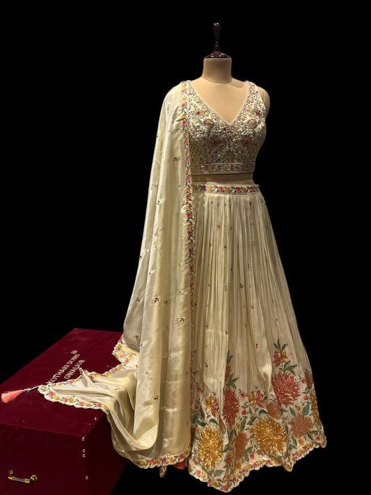 IVORY COLOUR TISSUE SKIRT WITH READYMADE CROP-TOP EMBELLISHED WITH RESHAM KARDHANA & ZARI WORK