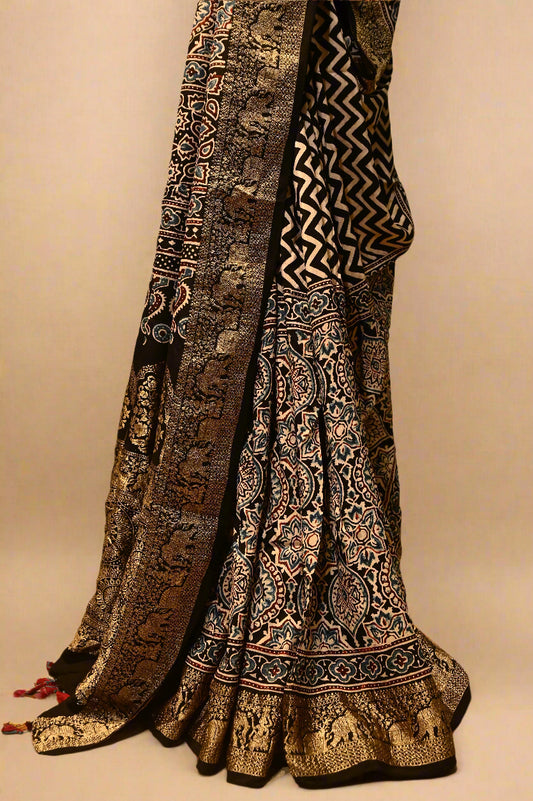 BLACK AJRAKH PRINT SAREE IN PLANT-BASED SILK WITH BLACK AJRAKH BLOUSE AND RICH BANARASI PALLA & BORDER