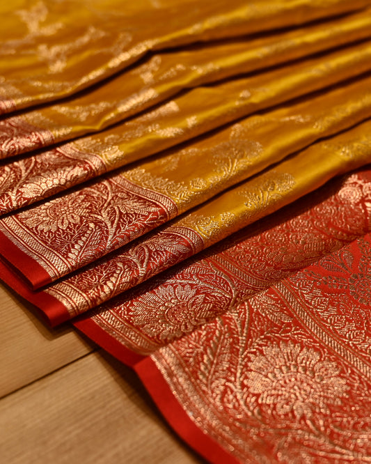 MUSTARD COLOUR BANARASI SATIN SAREE WITH CONTRAST RED BORDER PALLA & BLOUSE