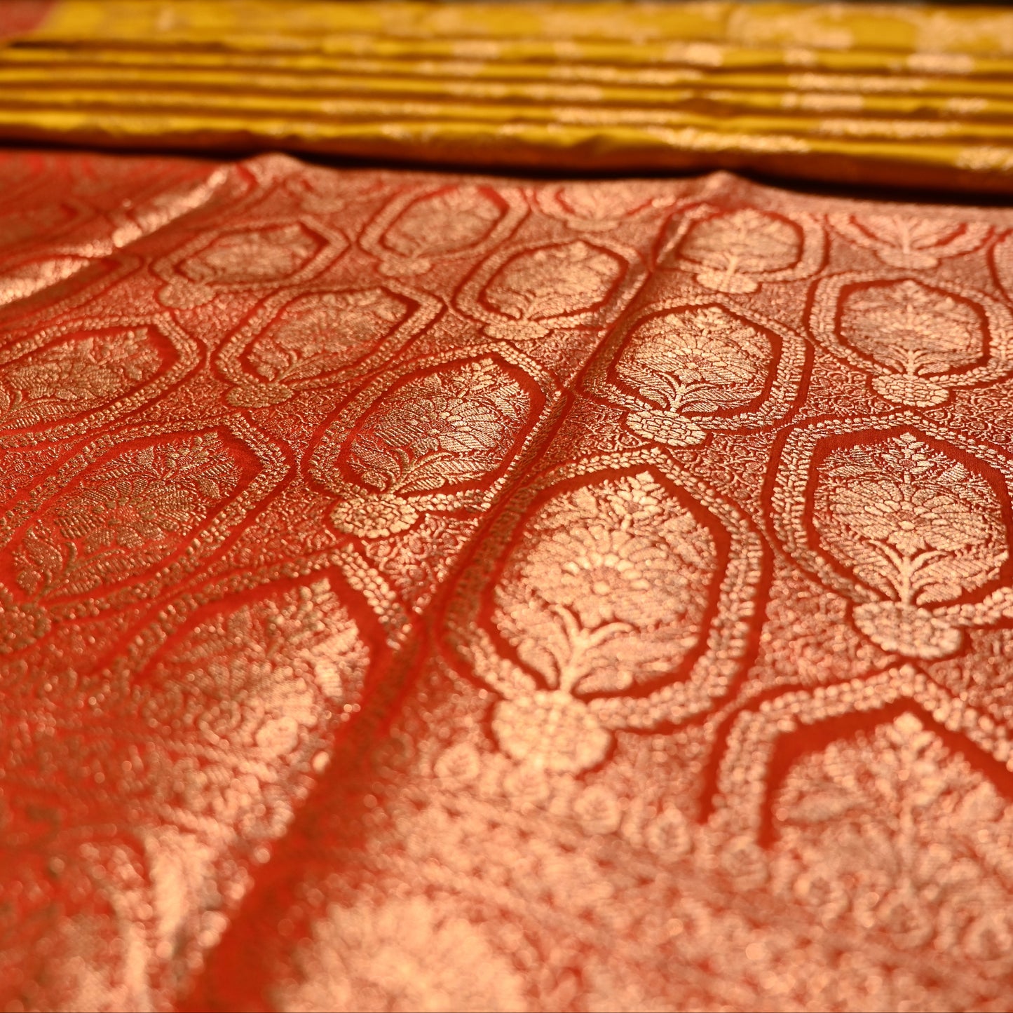 MUSTARD COLOUR BANARASI SATIN SAREE WITH CONTRAST RED BORDER PALLA & BLOUSE