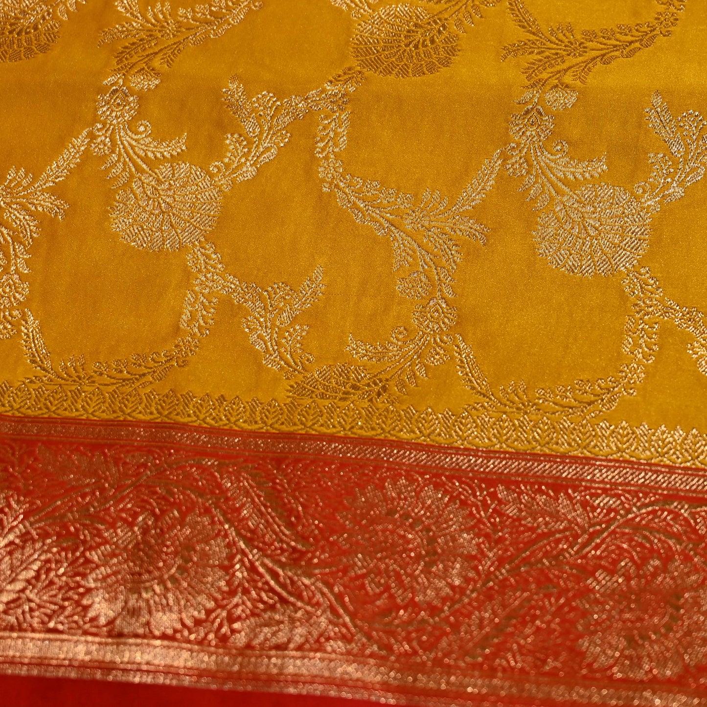 MUSTARD COLOUR BANARASI SATIN SAREE WITH CONTRAST RED BORDER PALLA & BLOUSE
