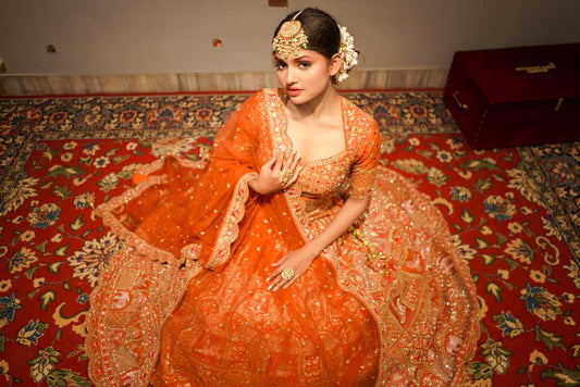 RUST ORANGE COLOUR SILK HAND EMBROIDERED LEHENGA EMBELLISHED WITH CUTDANA, SEQUINS & RESHAM EMBROIDERY WORK