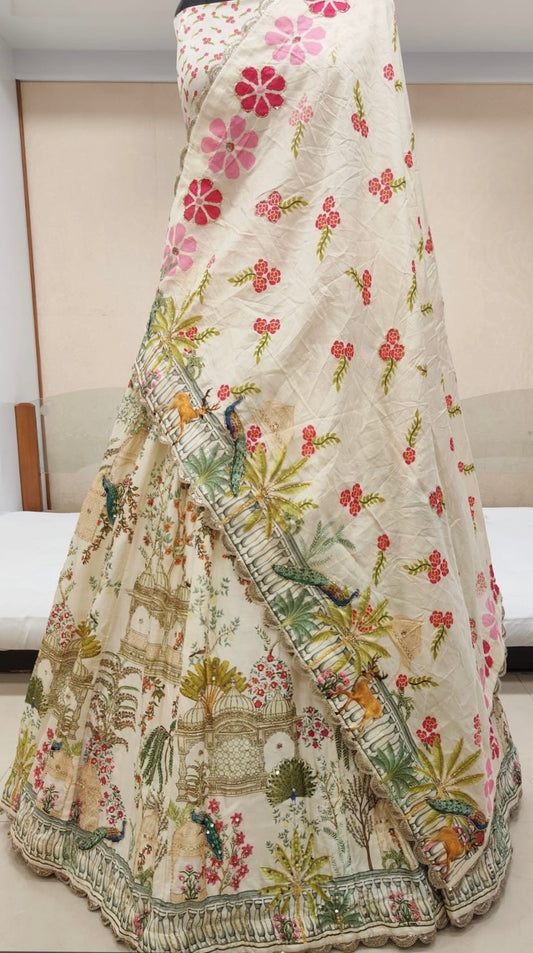 Ivory colour printed silk lehenga embellished with cutdana & sequins work