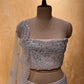 WHITE COLOUR NET EMBROIDERED LEHENGA WITH UNSTITCHED BLOUSE EMBELLISHED WITH RESHAM, MIRROR & SEQUINS WORK