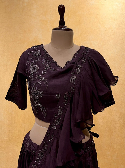 PURPLE COLOUR CREPE SILK SKIRT WITH EMBROIDERED BLOUSE & RUFFLE DUPATTA EMBELLISHED  WITH CUTDANA, SEQUINS WORK