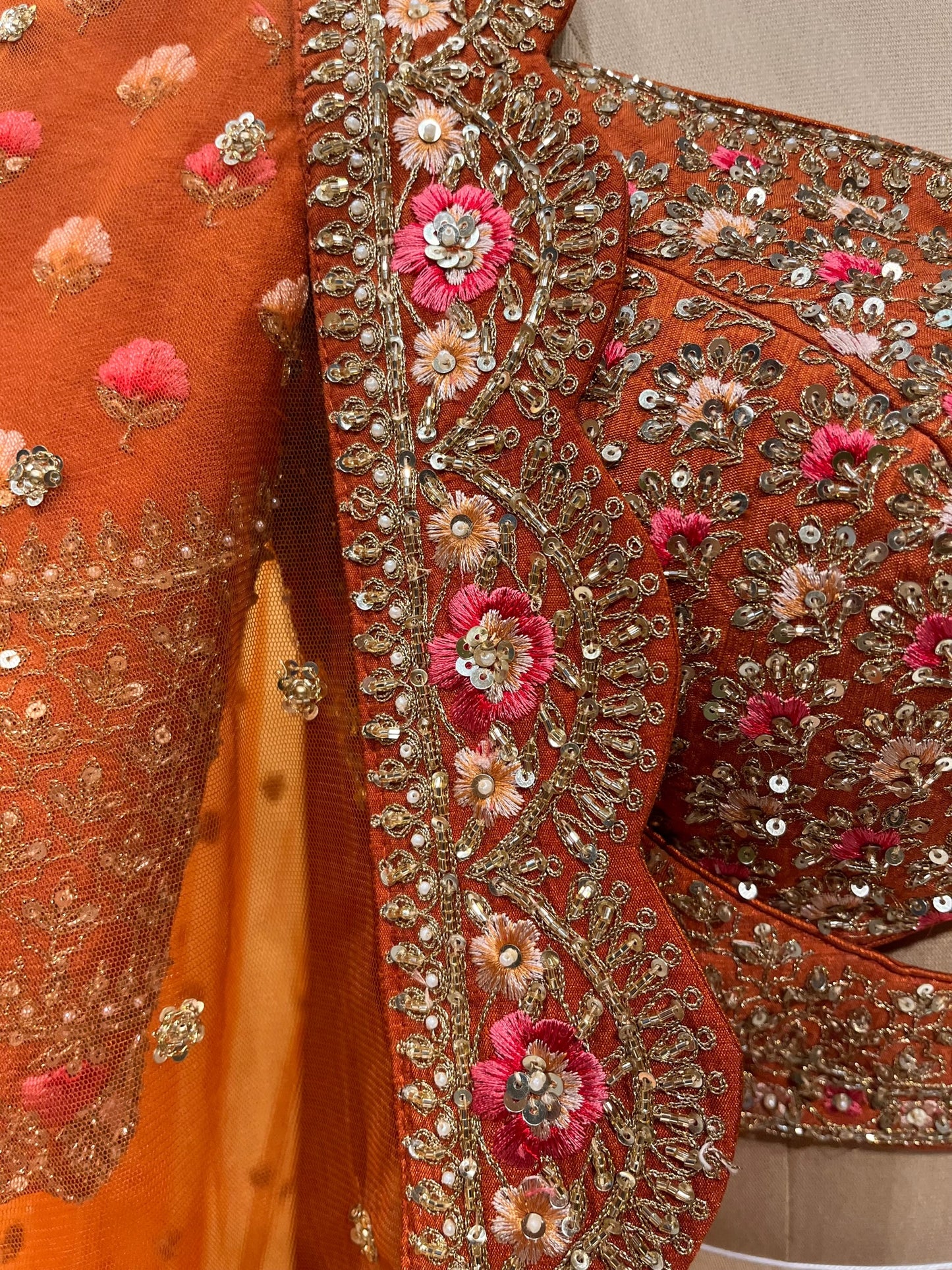 RUST ORANGE COLOUR SILK HAND EMBROIDERED LEHENGA EMBELLISHED WITH CUTDANA, SEQUINS & RESHAM EMBROIDERY WORK