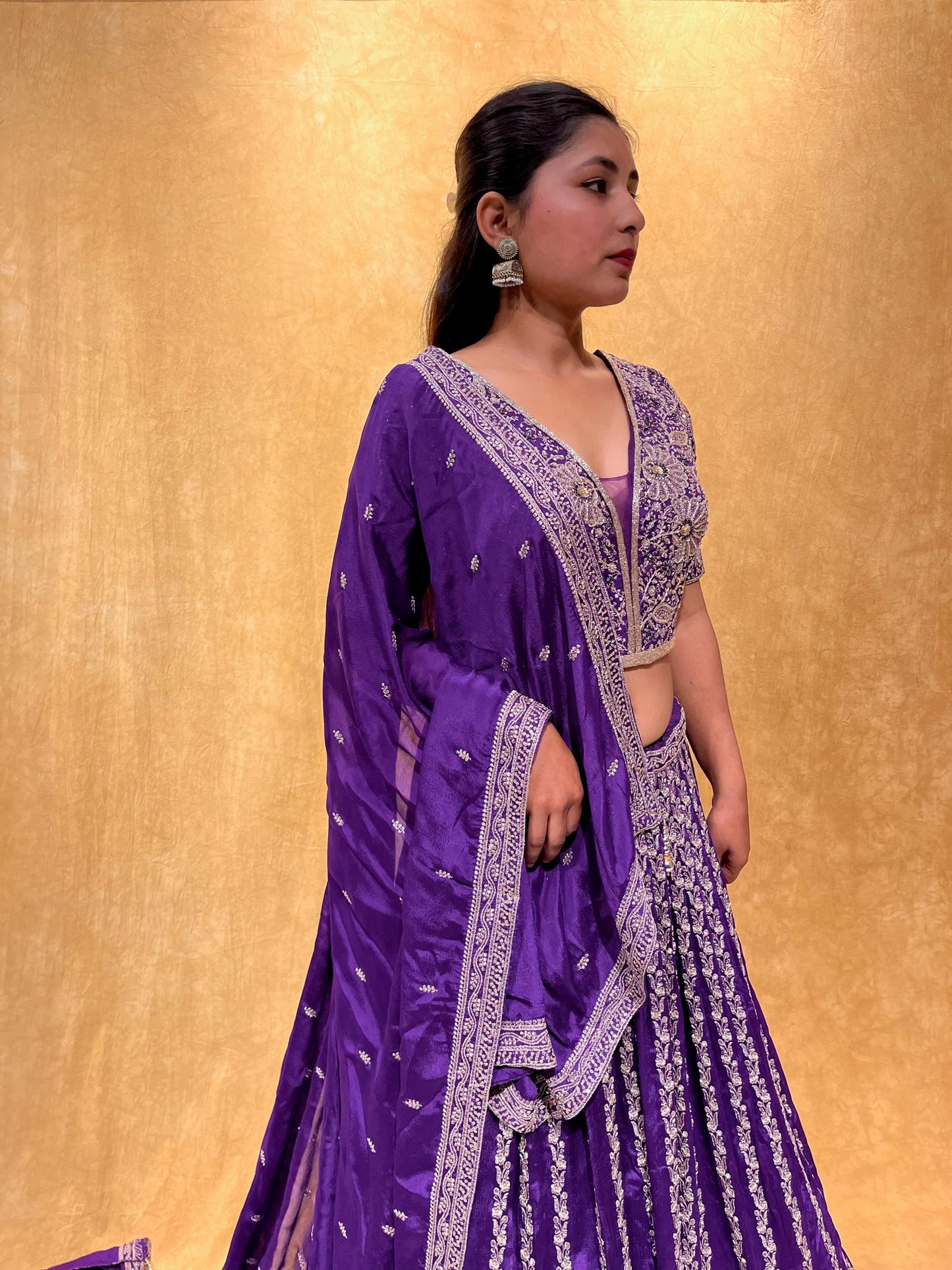 (DELIVERY IN 20-25 DAYS) PURPLE COLOUR CHINON HAND EMBROIDERED LEHENGA EMBELLISHED WITH ZARI & CUTDANA WORK