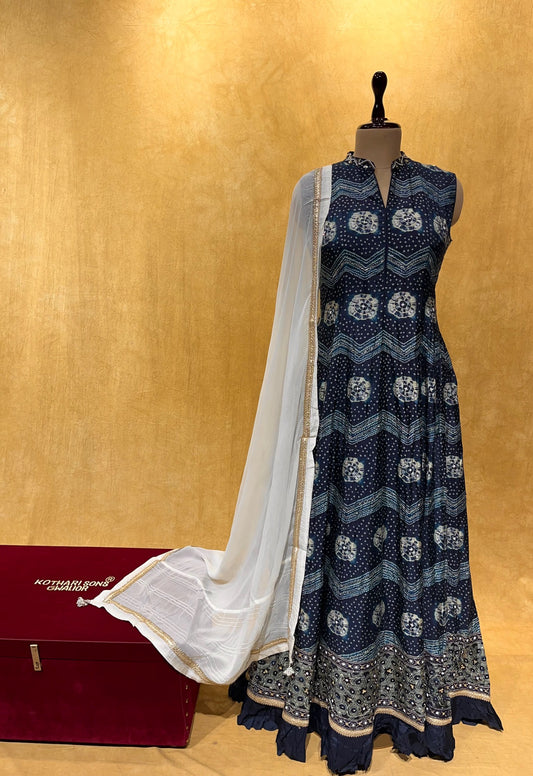 (DELIVERY IN 20-25 DAYS) BLUE COLOUR MUSLIN SILK FLOOR LENGTH BANDHANI PRINT SUIT WITH WHITE DUPATTA EMBELLISHED WITH SEQUINS WORK