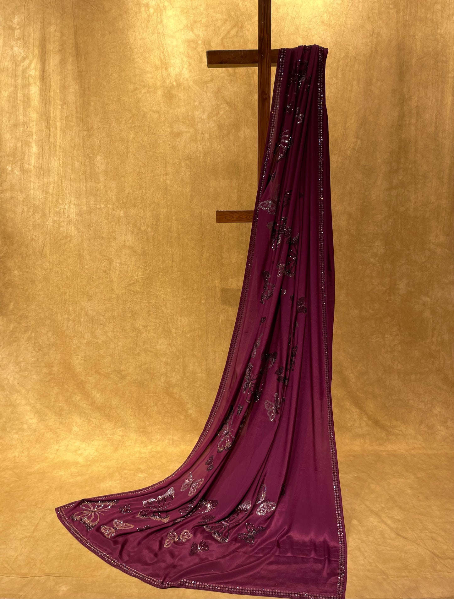 WINE COLOURE CREPE SATIN SAREE EMBELLISHED WITH BEAUTIFUL BUTTERFLY SWAROVSKI MOTIFS