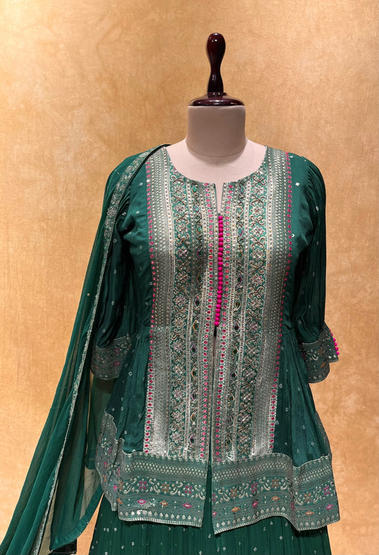 (DELIVERY IN 20-25 DAYS) BOTTLE GREEN COLOUR BANDHANI PRINT PEPLUM BLOUSE & SKIRT EMBELLISHED WITH CUTDANA &  MIRROR WORK
