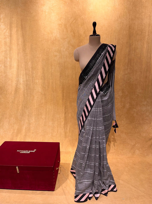 GREY COLOUR LINEN SAREE EMBELLISHED WITH CUTDANA WORK