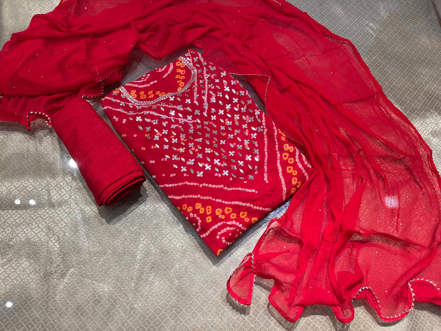 RED COLOUR BANDHEJ GEORGETTE UNSTITCHED SUIT EMBELLISHED WITH GOTA PATTI WORK