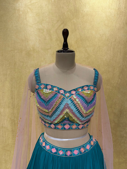 (DELIVERY IN 20-25 DAYS) TURQUOISE BLUE GEORGETTE LEHENGA WITH DESIGNER BLOUSE EMBELLISHED WITH CUTDANA WORK