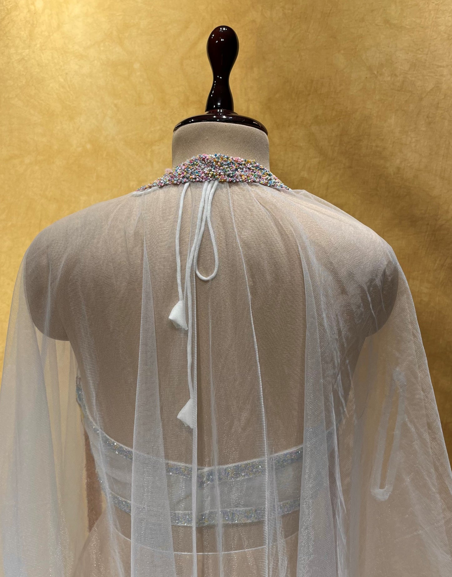WHITE COLOUR ORGANZA PALAZZO WITH HAND EMBROIDERED CROP TOP BLOUSE & NET SHRUG EMBELLISHED WITH CUTDANA WORK