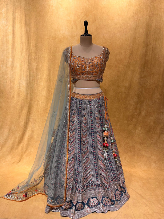 TEAL BLUE COLOUR SILK LEHENGA WITH CONTRAST BLOUSE EMBELLISHED WITH CUTDANA & SEQUINS WORK