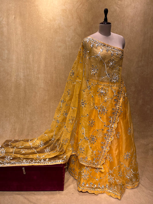 (DELIVERY IN 20-25 DAYS) BRIDESMAIDS YELLOW COLOUR ORGANZA LEHENGA WITH UNSTITCHED BLOUSE EMBELLISHED WITH GOTA PATTI WORK