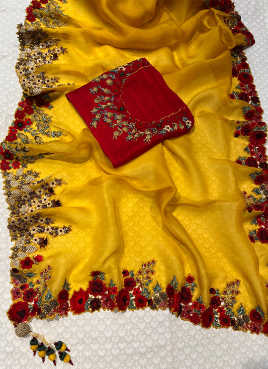MUSTARD COLOUR PURE ORGANZA HAND EMBROIDERED SAREE EMBELLISHED WITH SEQUINS, CUTDANA & ZARDOSI WORK