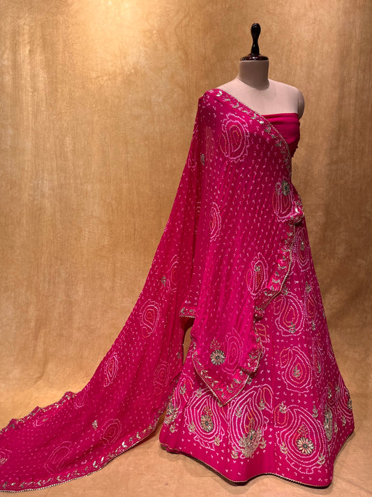 ( DELIVERY IN 25 DAYS ) PINK COLOUR BANDHEJ OJARIYA LEHENGA WITH UNSTITCHED BLOUSE EMBELLISHED WITH GOTA PATTI & CUTDANA WORK