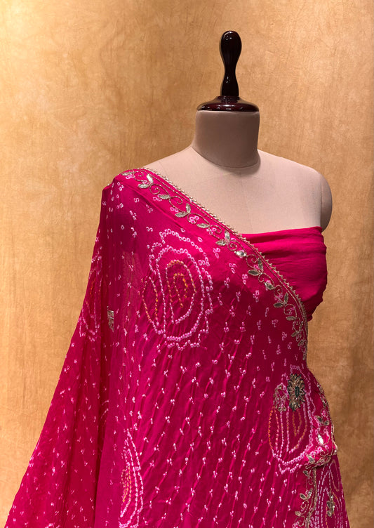 ( DELIVERY IN 25 DAYS ) PINK COLOUR BANDHEJ OJARIYA LEHENGA WITH UNSTITCHED BLOUSE EMBELLISHED WITH GOTA PATTI & CUTDANA WORK