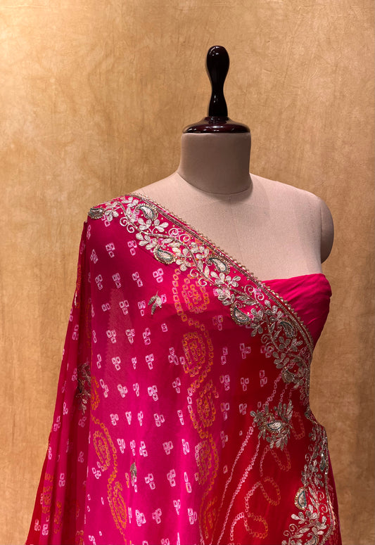 (DELIVERY IN 20-25 DAYS) PINK SHADED BANDHEJ LEHENGA WITH UNSTITCHED BLOUSE EMBELLISHED WITH GOTA PATTI & CUTDANA WORK