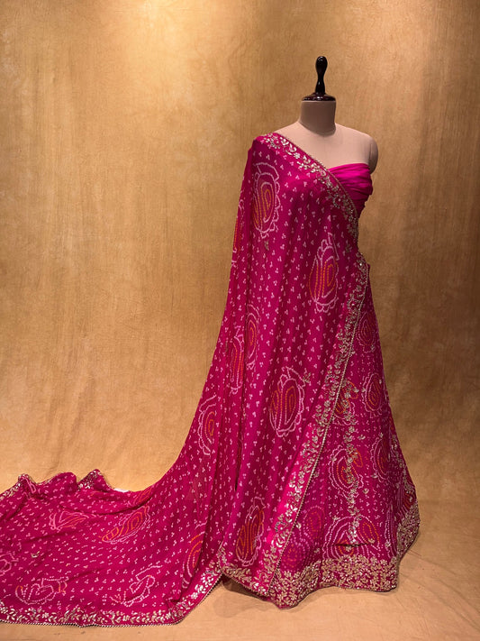 (DELIVERY IN 20-25 DAYS) PINK COLOUR BANDHEJ LEHENGA WITH UNSTITCHED BLOUSE EMBELLISHED WITH GOTA PATTI & CUTDANA WORK