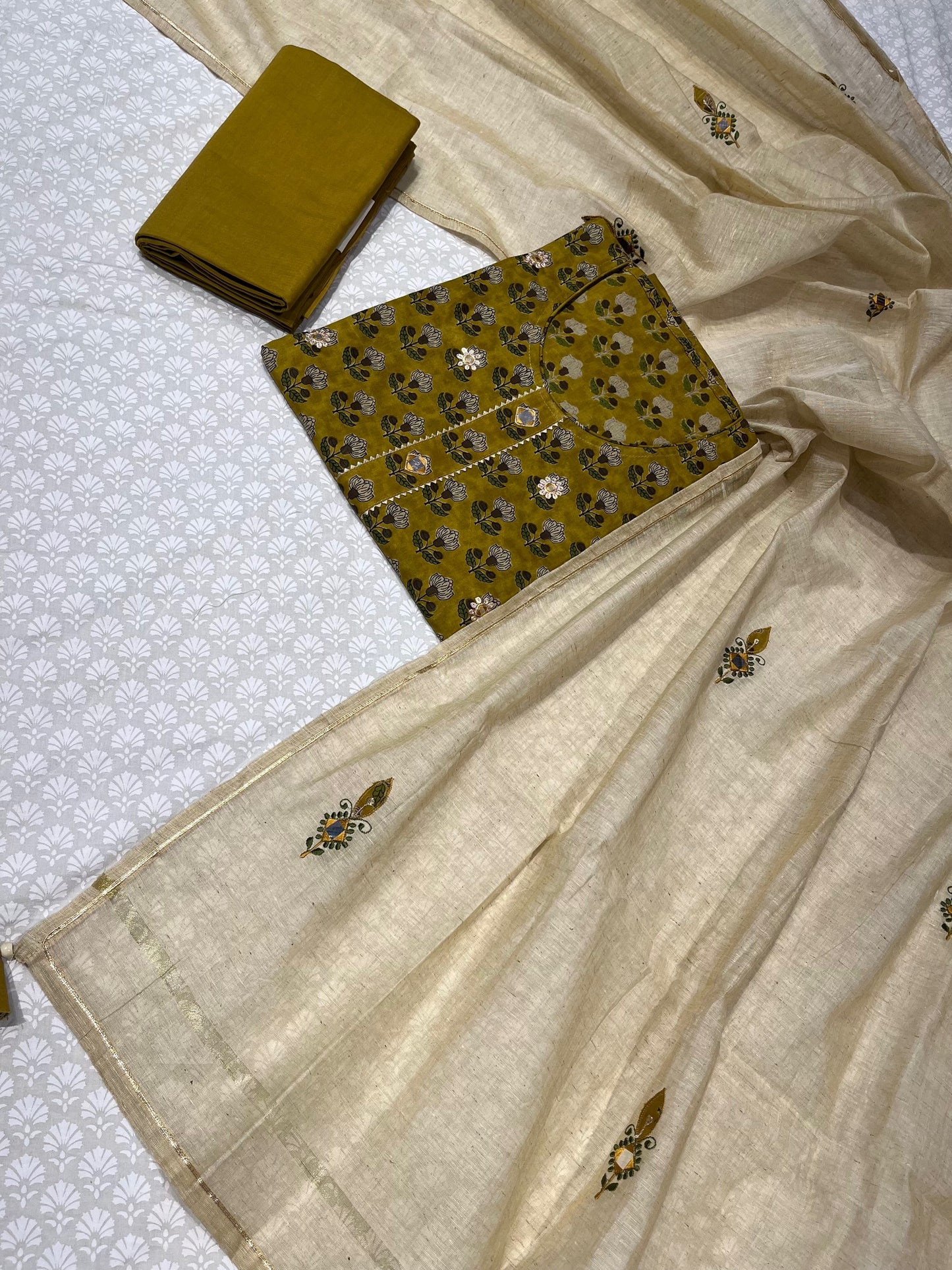 (DELIVERY IN 30 DAYS) MEHENDI GREEN COLOUR COTTON SUIT WITH CHANDERI DUPATTA EMBELLISHED WITH MIRROR FOIL WORK